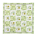 Baby Quilt displaying John Deere Tractors, Green Plaid