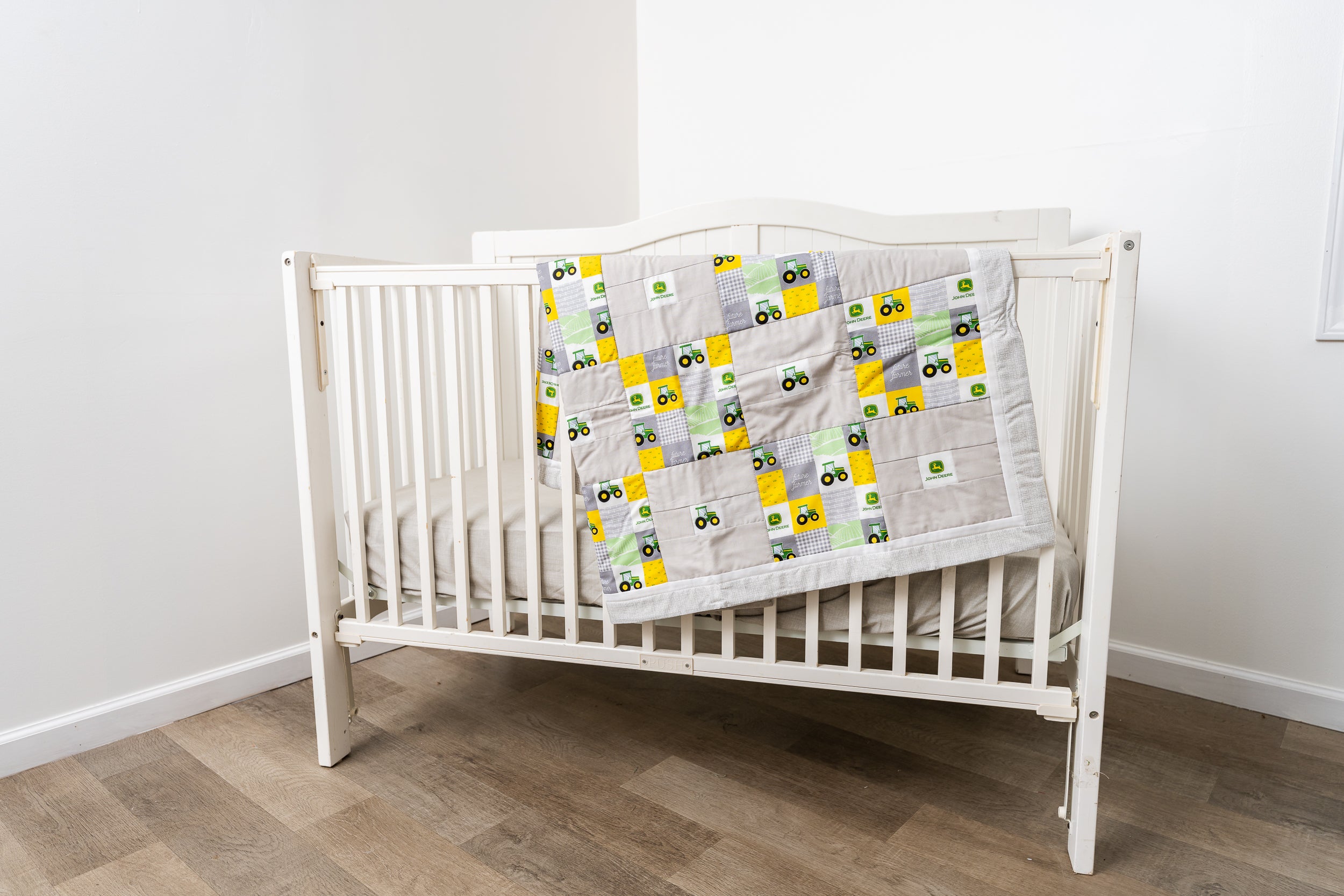 Nursery Set displaying John Deere Tractors and Logos, Block Print